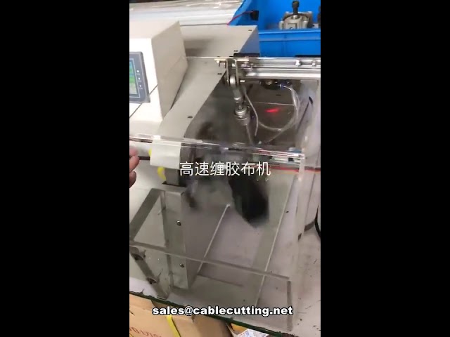 Macchina automatica per avvolgimento e nastratura cavi multifilo, con copertura protettiva